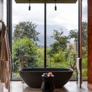 Tourism + Culture, Singita Kwitonda Lodge, bathroom, mountain, shrubs